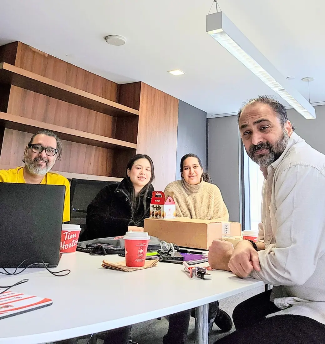 Husain with the campaign team at a working meeting
