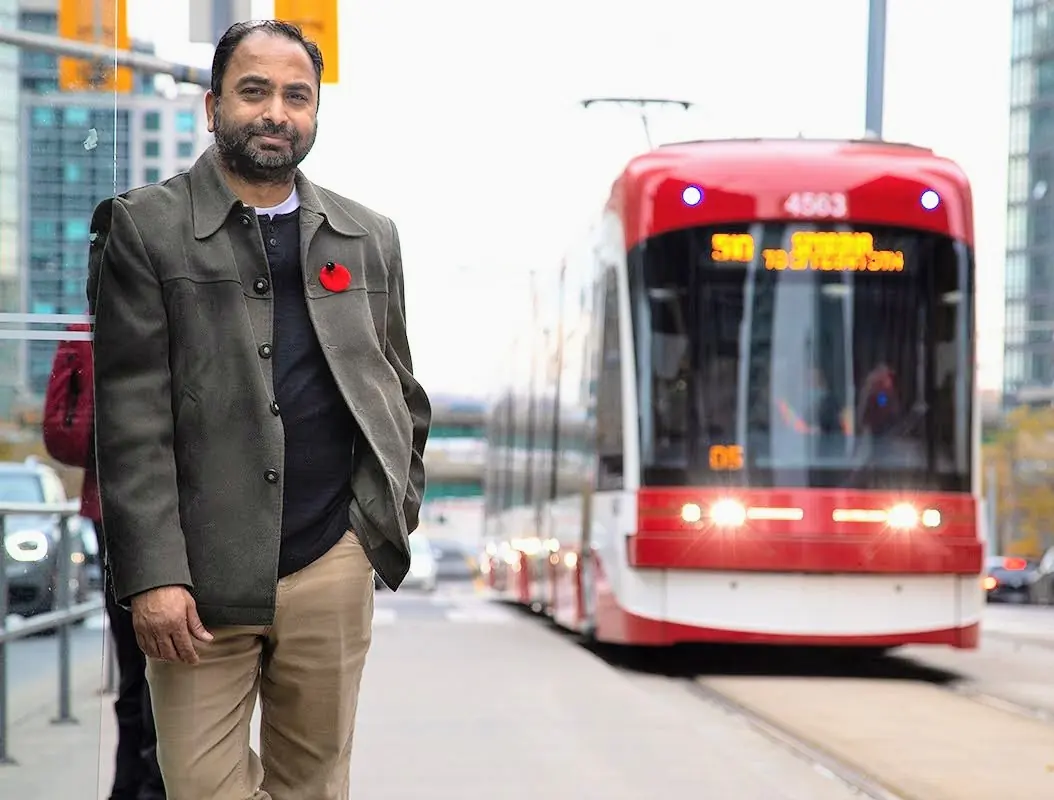 Husain at a Toronto streetcar stop