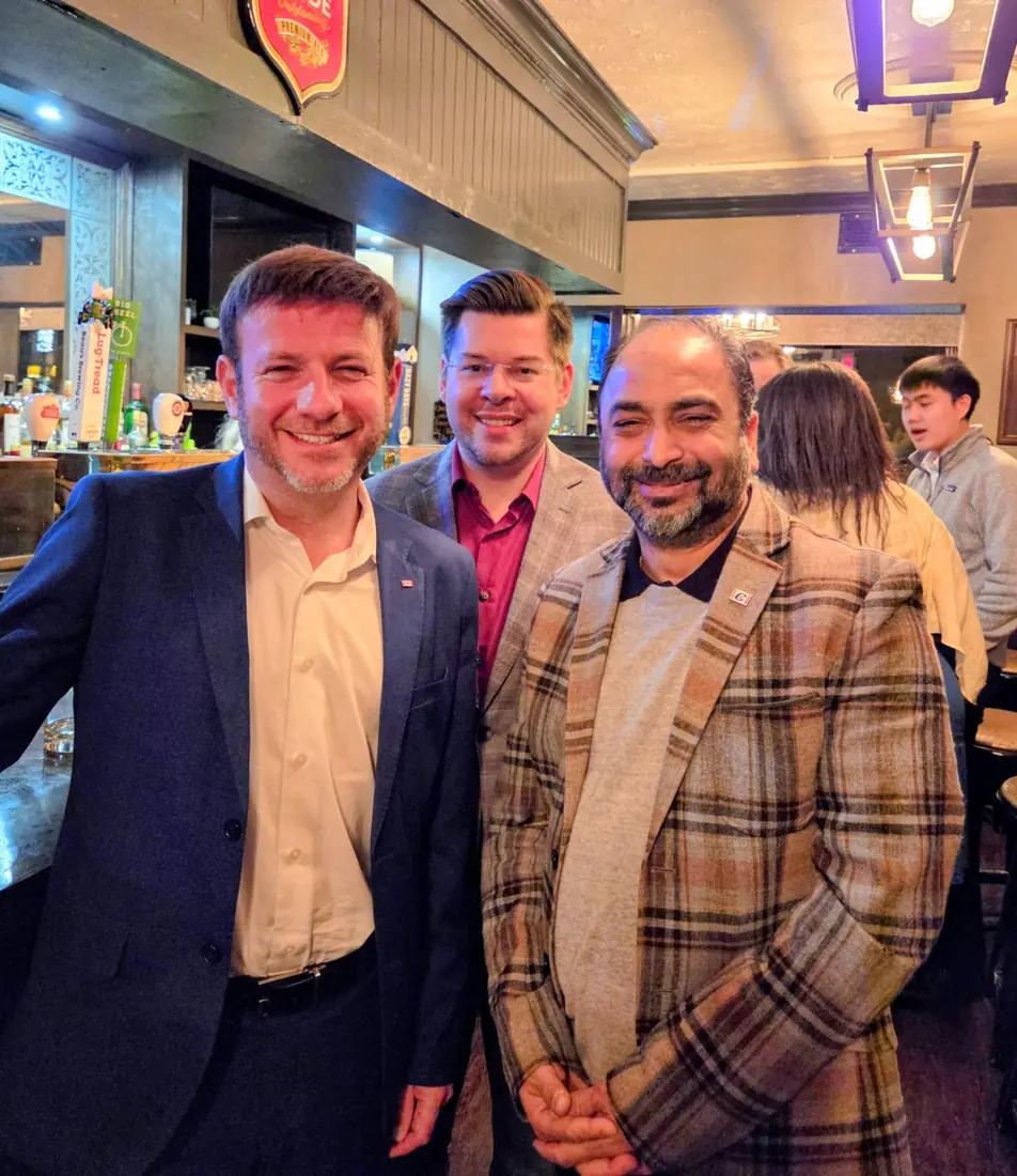 Husain with colleagues at a local pub
